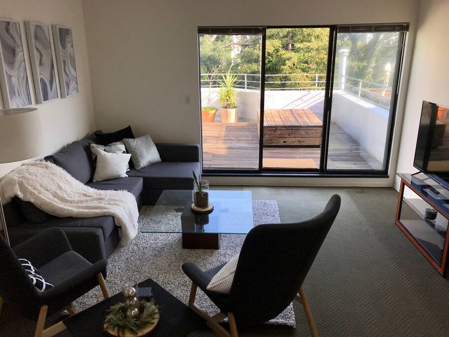 Lounge area with access to deck/ private rooftop entrance