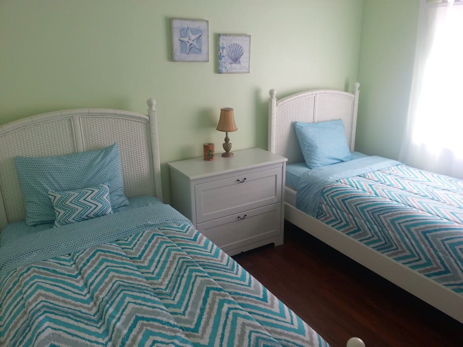 Bedroom #3 with two single beds and new bedding