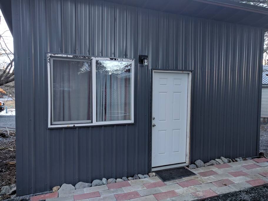 Entrance to Spruce Camp Cabin. Two hiking trail heads are located within two blocks.