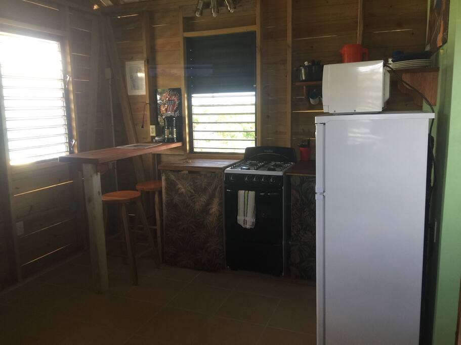 Full kitchen with coffee bar & counter space.