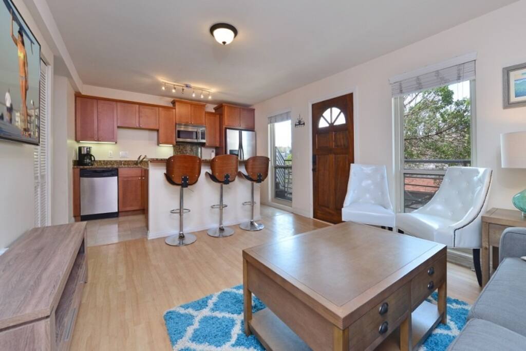 Living room and kitchen with breakfast counter