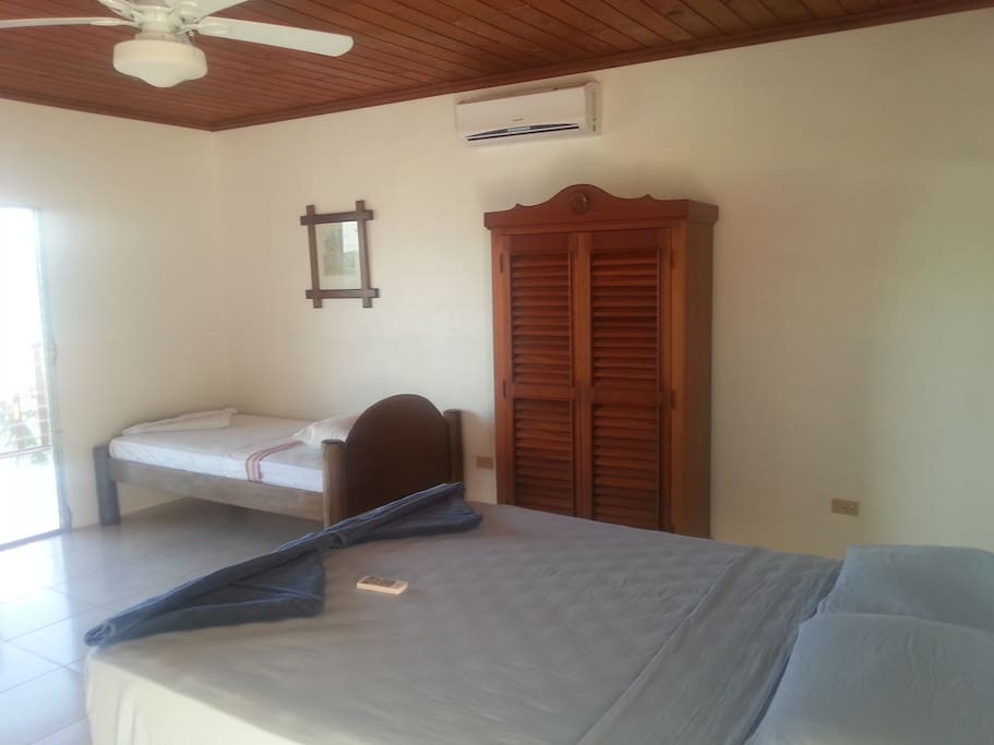 Large room, Orthopedic beds, original artwork, air conditioning, ceiling fan, cool tile, huge bathroom.