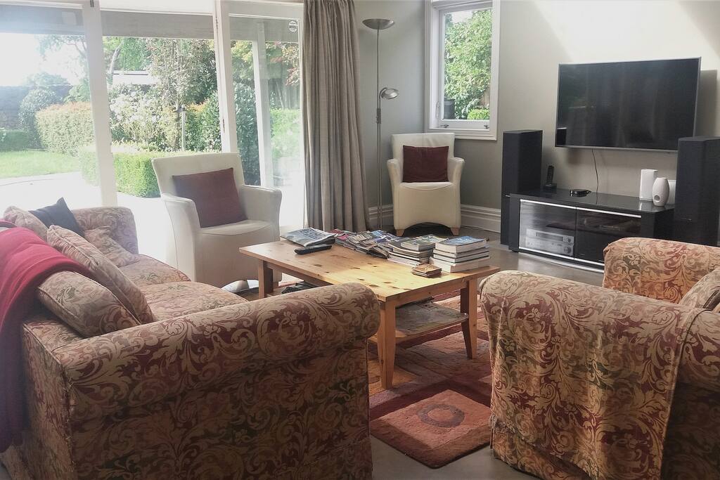 Comfortable and relaxed seating in the Guest Lounge with large 1.2m TV and NetFlix. Lovely garden access and views.