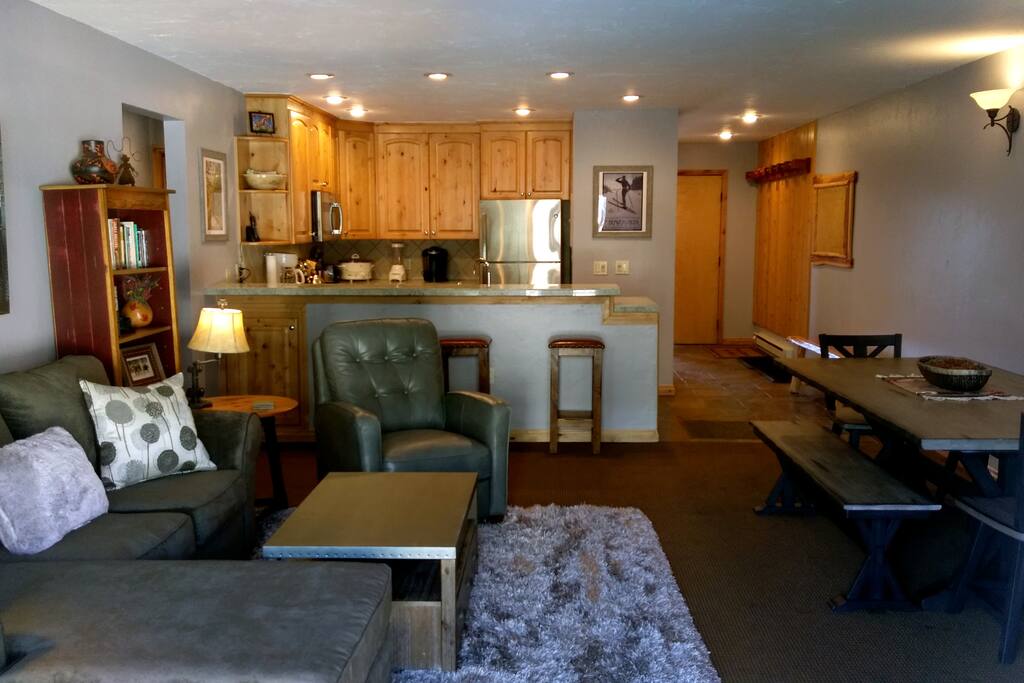 Beaver Creek West P-2 living room with sofa bed, gas fireplace and dining table