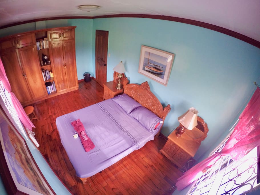 Bedroom with queen size bed, available closet space, air condition with both windows that overlooks the rice fields.