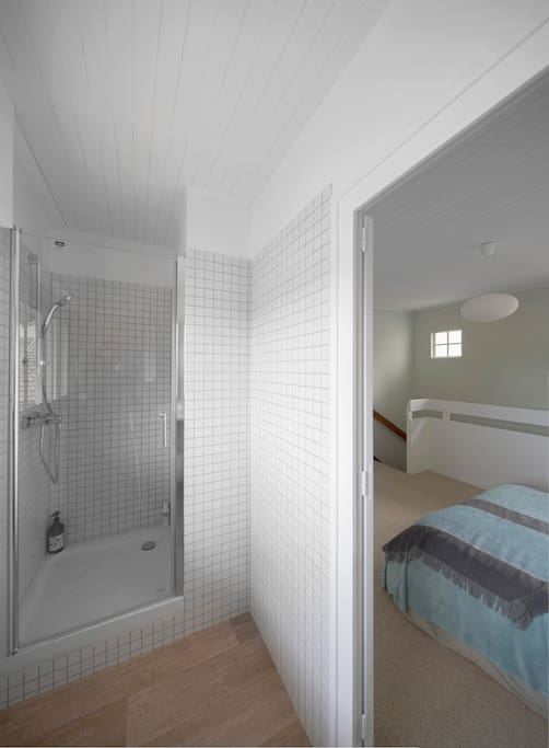 Bathroom is beautifully renovated with with tiles and shiny surfaces and very comfortable shower.