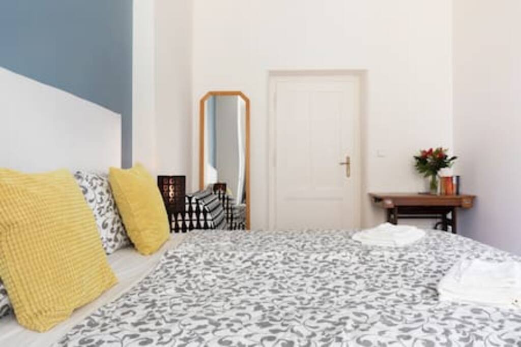 Bedroom 1 with king size bed and sofa bed, wooden floor