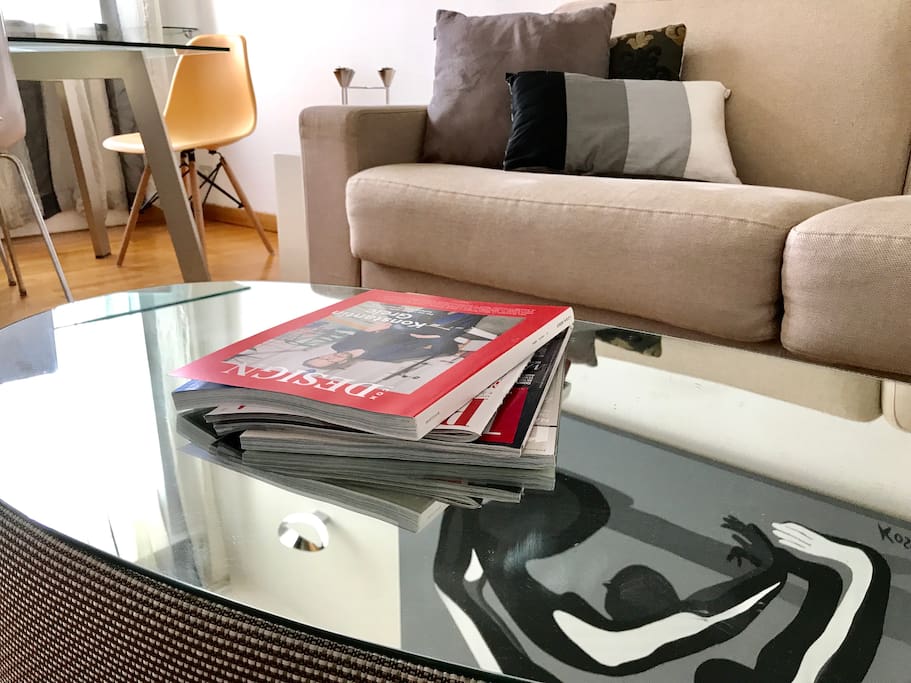Natuzzi mirror coffee table in front of the sofa bed