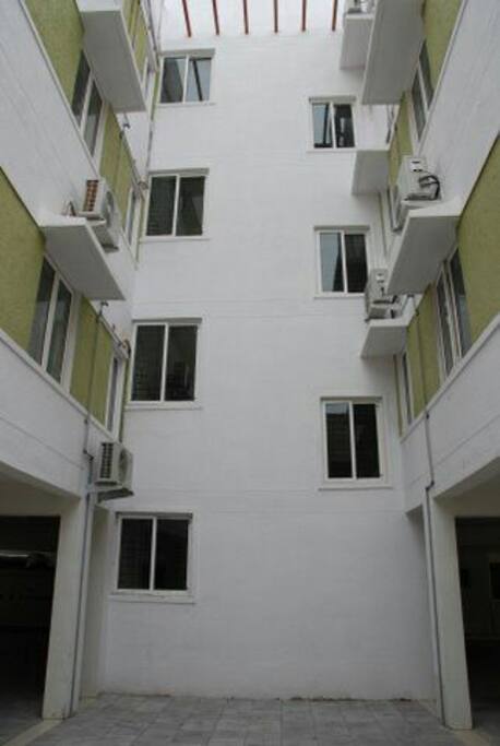 Just three floors and each floor having only 2 apartments; No shared wall.