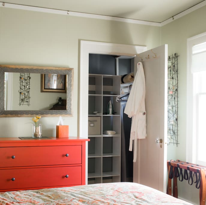 Plenty of closet place to hang clothing, iron and ironing board