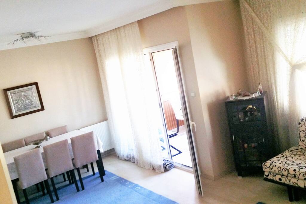 Dining room table for 6 person. Balcony on the right side.