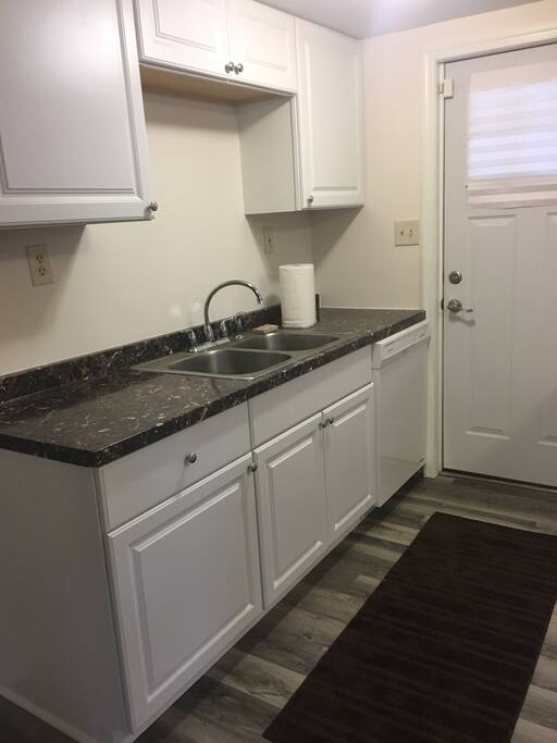 Dishwasher, sink and ample cabinet space.