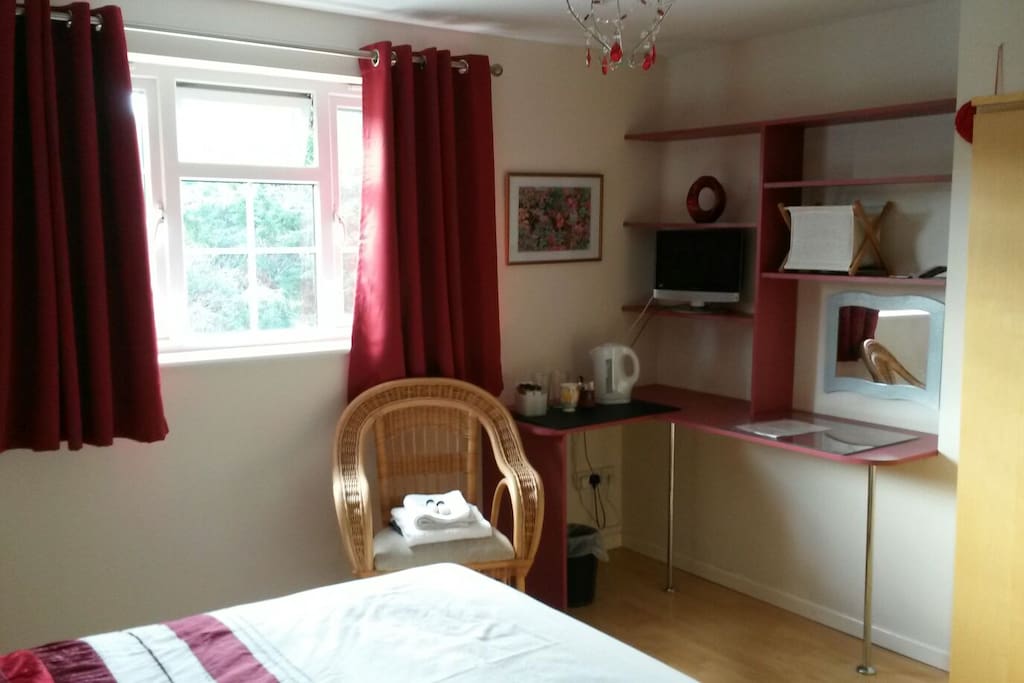 Black out curtains to ensure good night sleep. Shelves and desk/ dressing table with mirror. Tv provided with built in dvd player