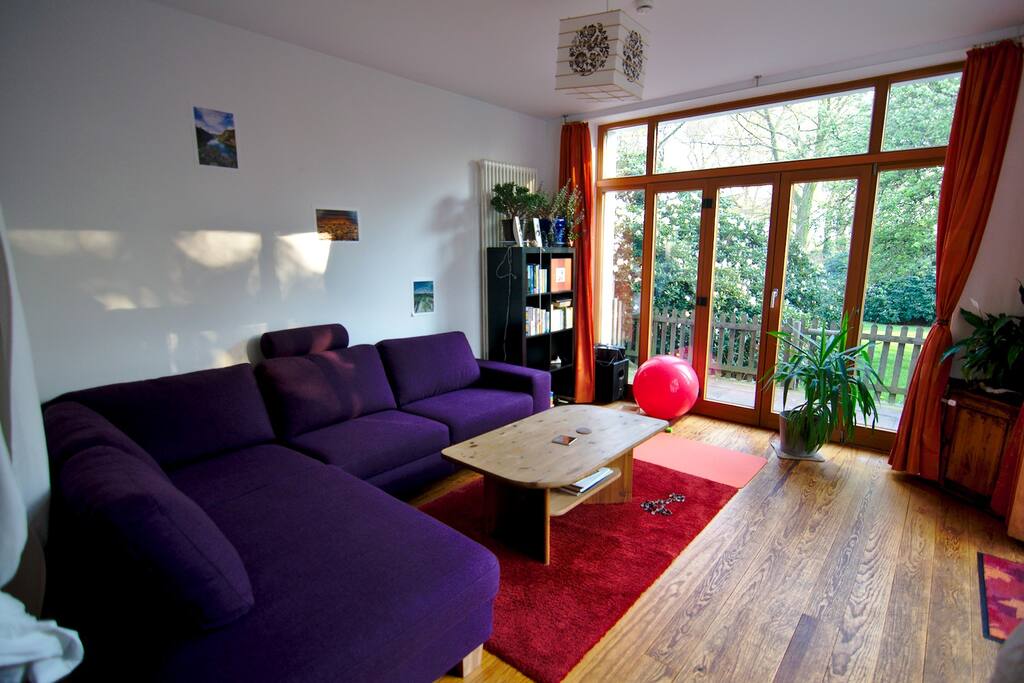 Spacious living room with comfy sofa with pull-out double-bed