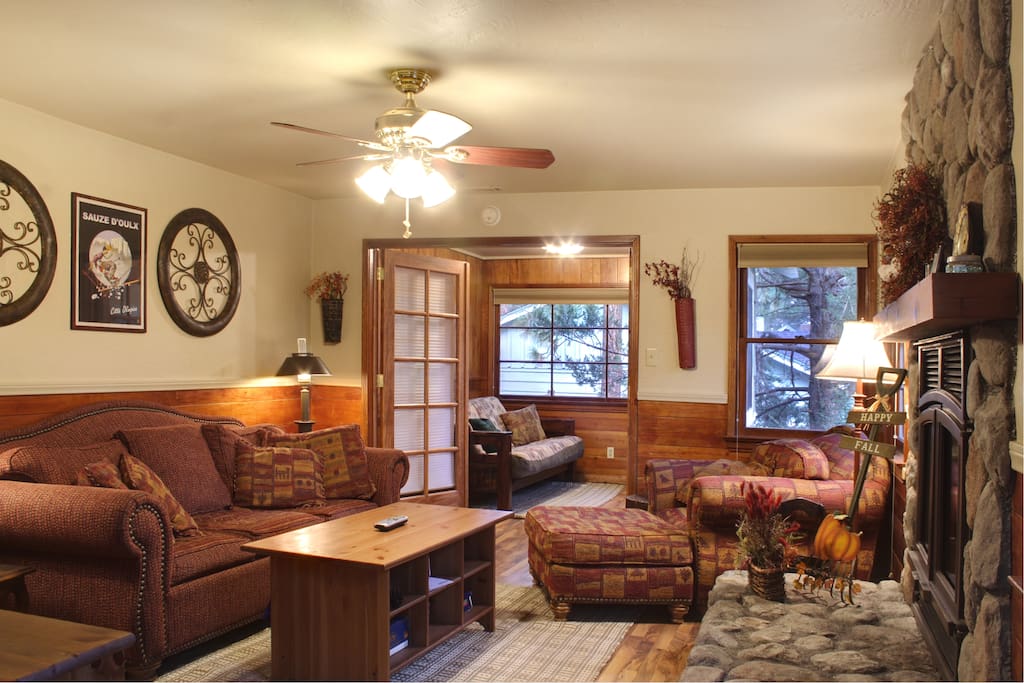 Enter into a warm living room with fireplace