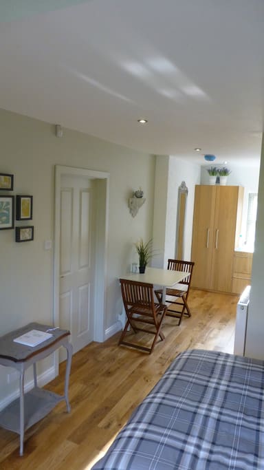 Dining area leading into kitchenette