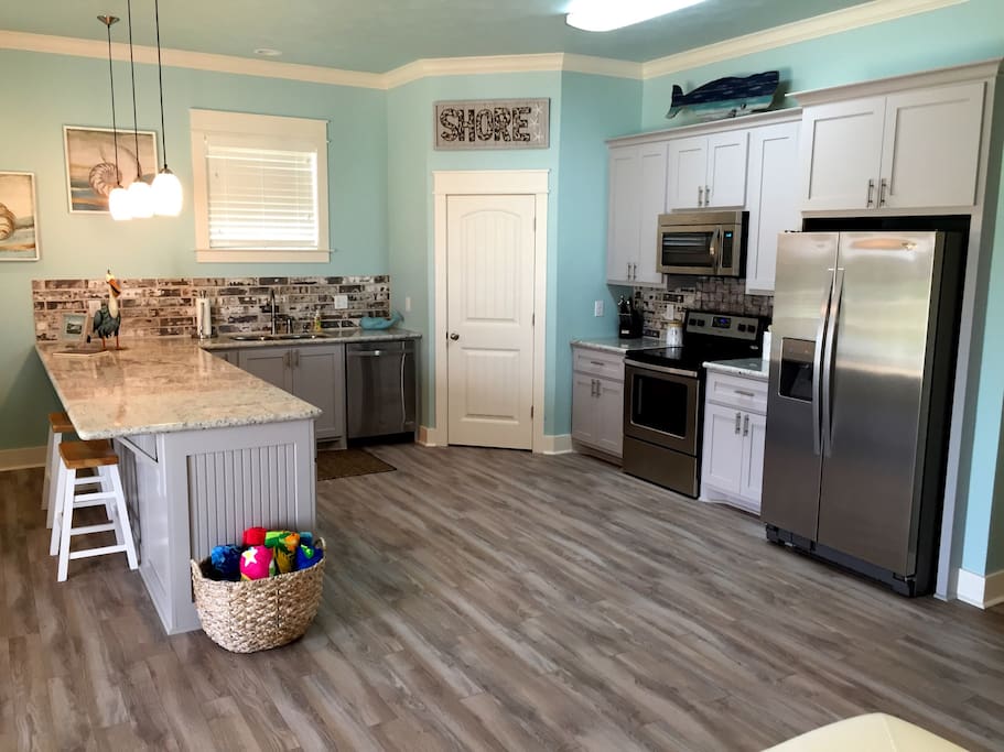 A fully stocked kitchen with pretty much everything you need to cook up a Sunday dinner or a midnight snack. A coffee maker is on the counter to help you enjoy the sunrise from the deck.
