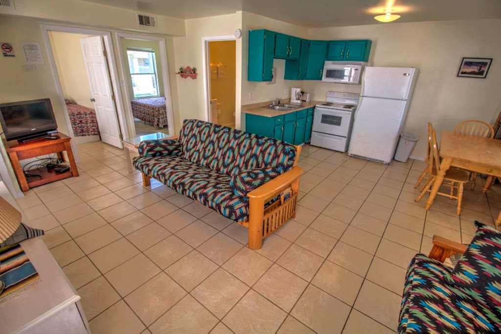 Full Kitchen with Fridge, Stove, & Microwave.