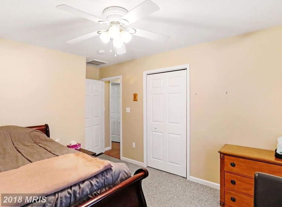 2nd Floor Guest Room with comfy full bed, carpet, end table, desk with chair and dresser