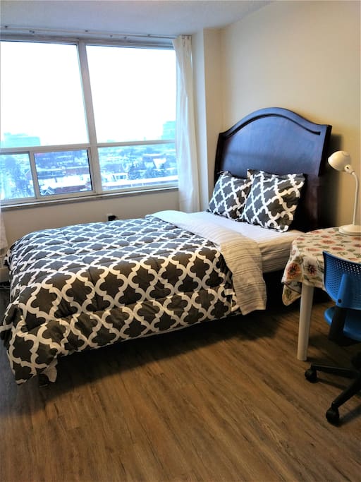 Bedroom with a queen bed, view, plenty of sunlight & ventilation!