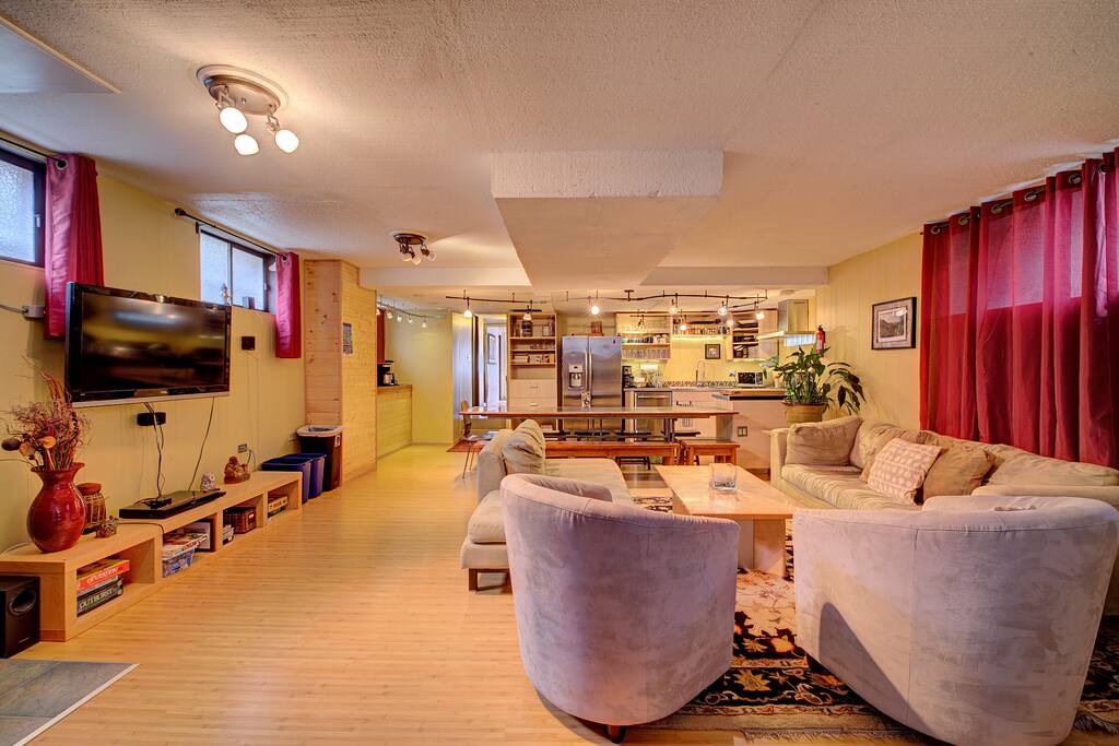 Spacious living room w/ plenty of seating .The TV comes w/ a roku & netflix.