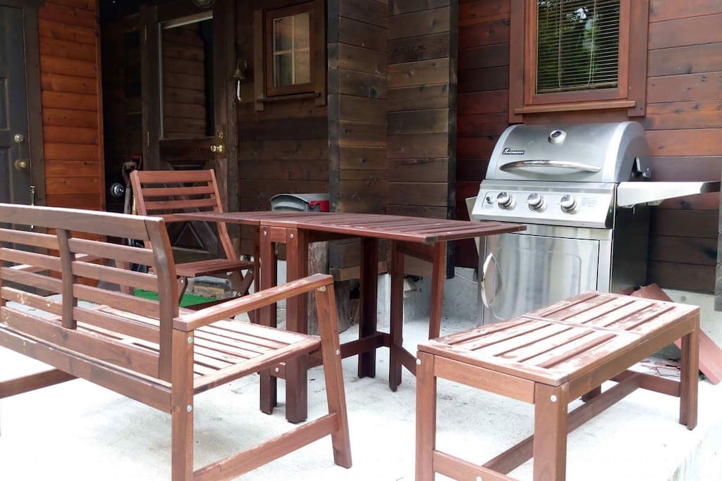 Out door sitting area with gas BBQ.
