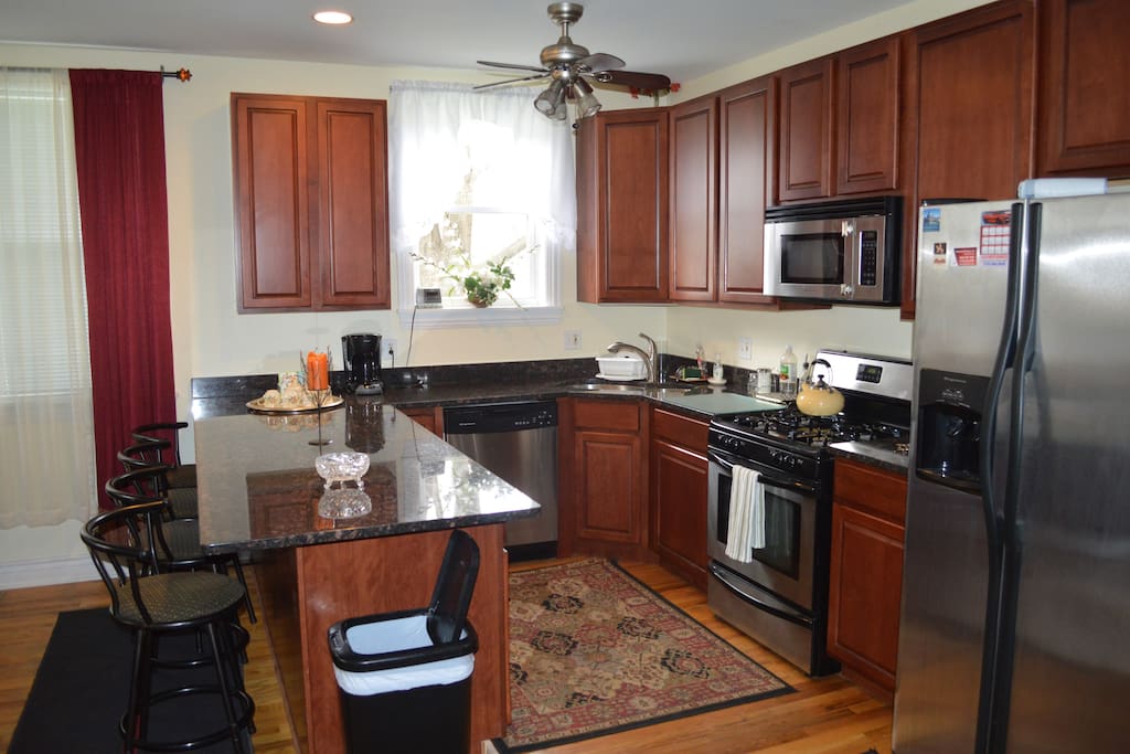 Another view of the kitchen. You may notice we have upgraded to swivel chairs. We continue to improve upon our lovely BnB.