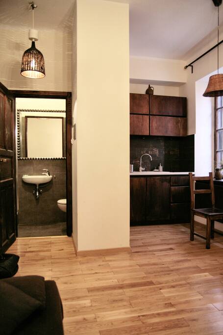 Kitchenette plus table plus bathroom. Altogether.