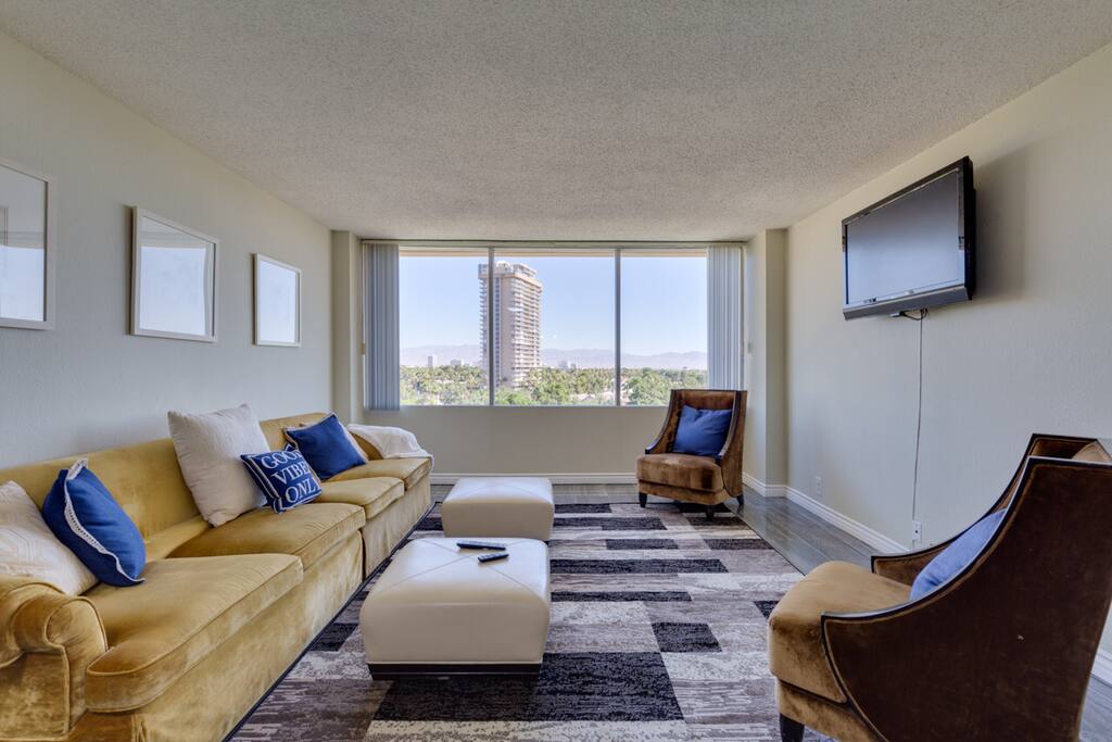 Large windows with Views of the Country Club and Strip.