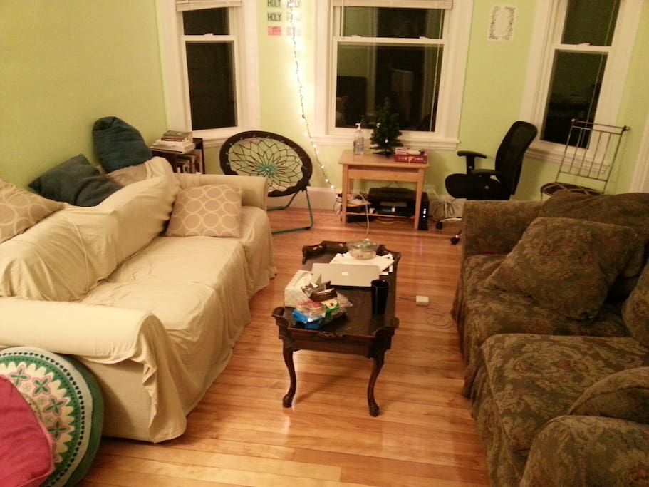 living room: 2 couches, coffee table, assorted chairs (for guests!), bookshelf