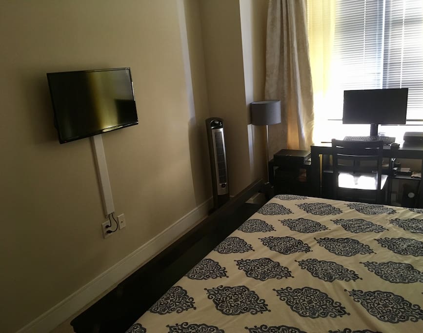 Also in your bedroom, your own TV (with an Apple TV connected to it!), fan/ionizer, and a desktop computer for your use.