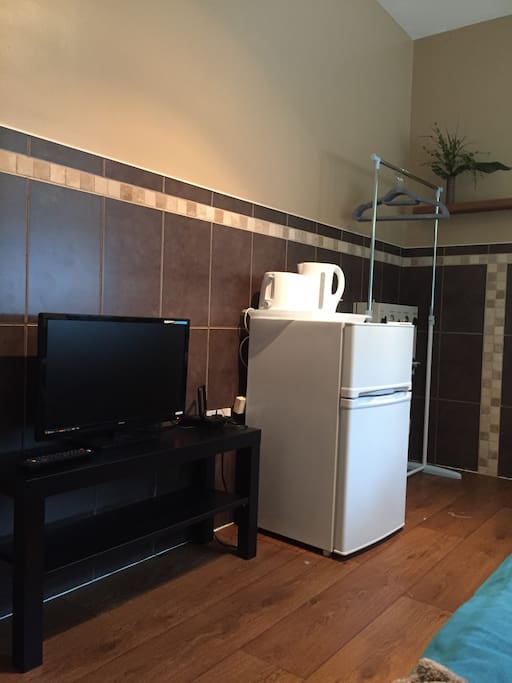 Smart TV in your room, kettle, toaster, fridge freezer and rail.