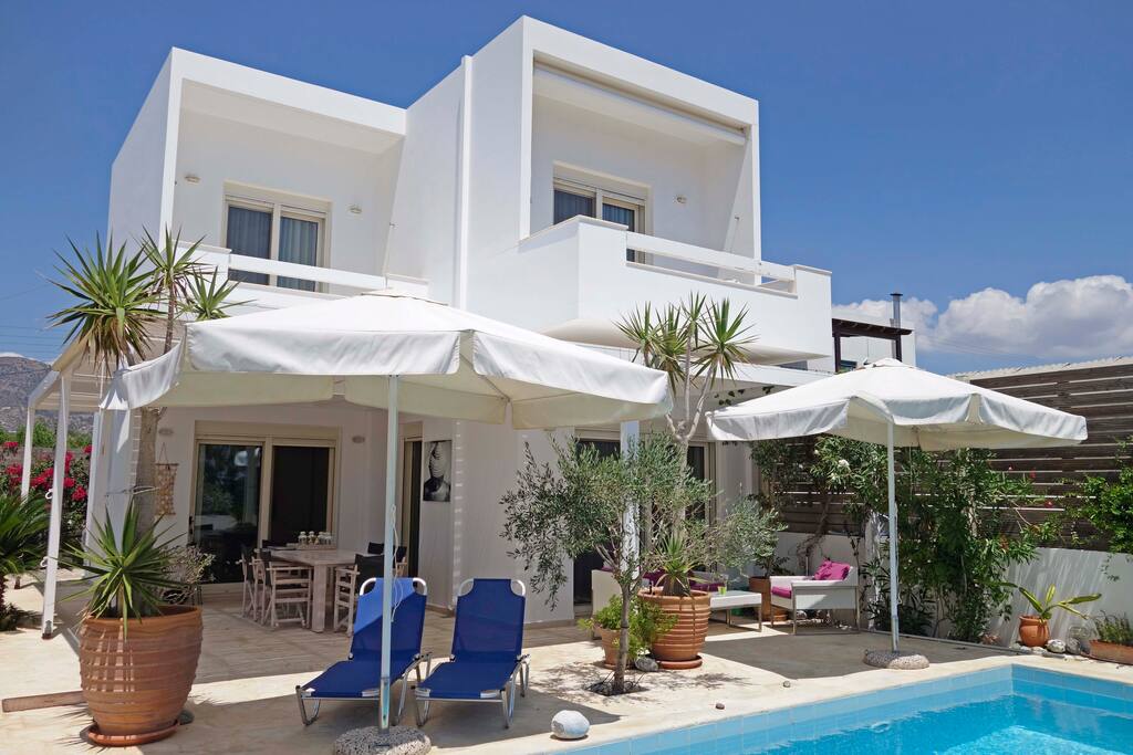 the villa frontside with big balconies overlooking the sea