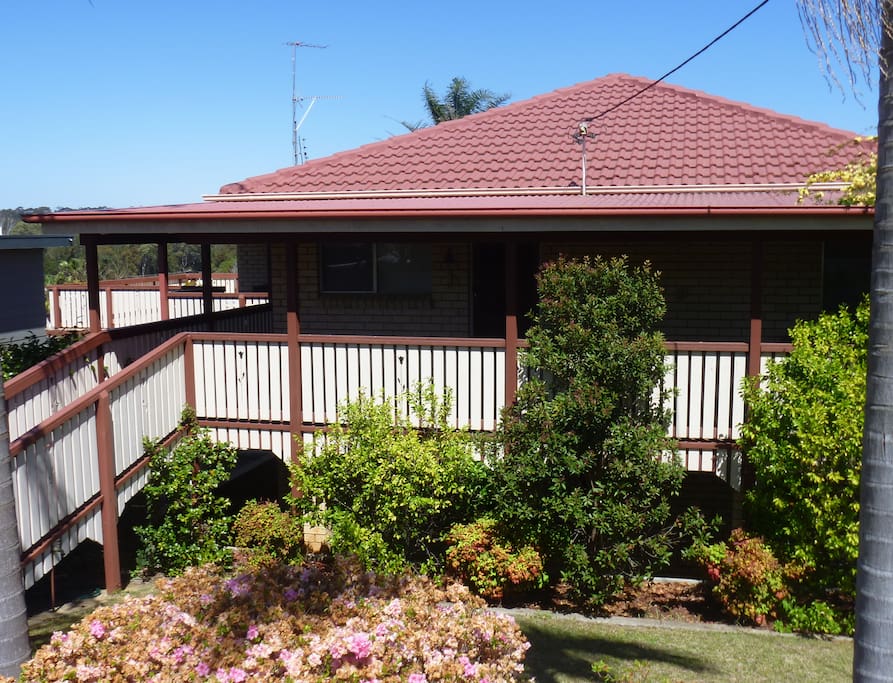 Street-view of home, with wrap-around verandahs on two sides