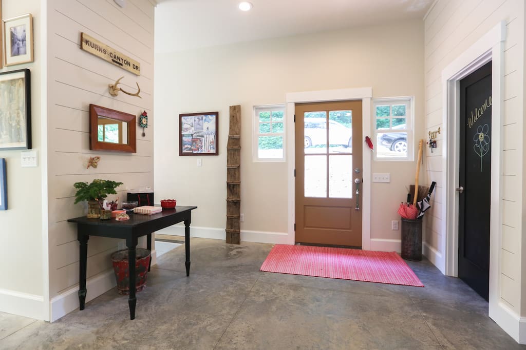 Front door area with a half-bath.