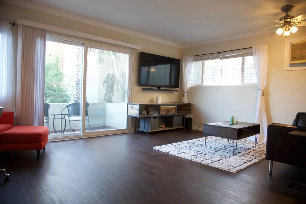 65 INCH TV, SURROUND SOUND, BALCONY, CB2 READING CHAIR