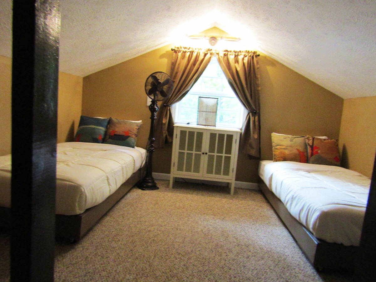 Twins bed in loft but are on rollers and can be hooked together Queen size bed.