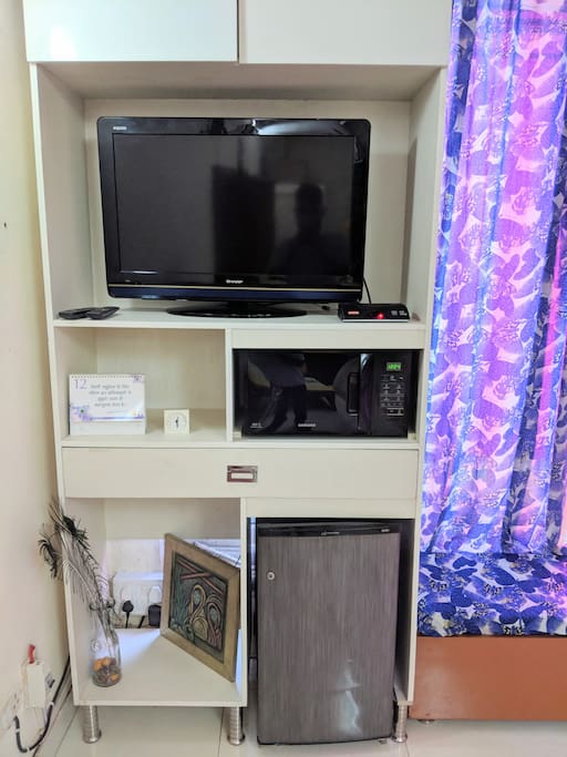 Dinning area is equipped with TV, Microwave, and fridge !