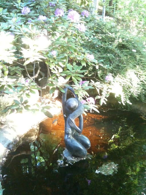 Two water features can be found on the propety: This one, a gold fish pond with African stone scupture
