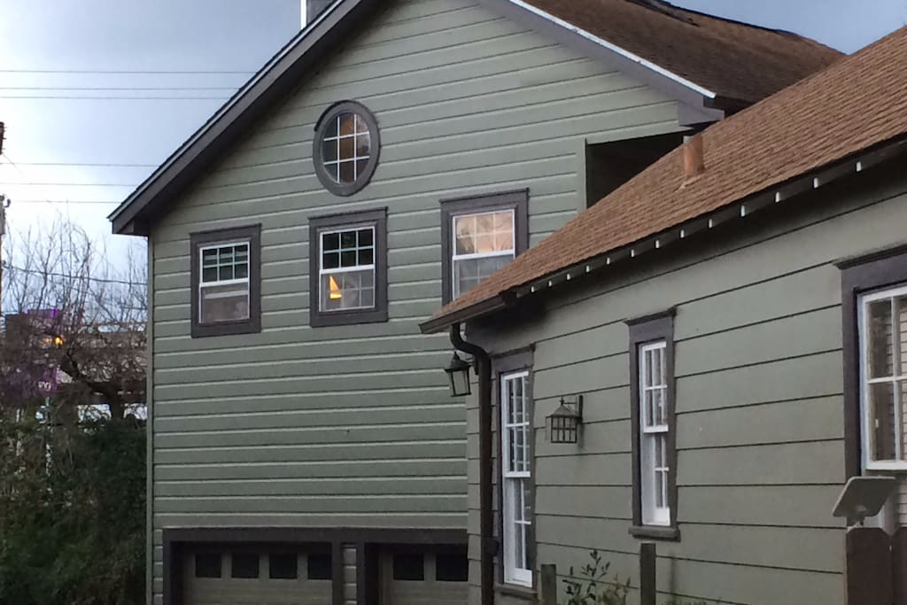 View from the street, we are above the garage with the circle window.