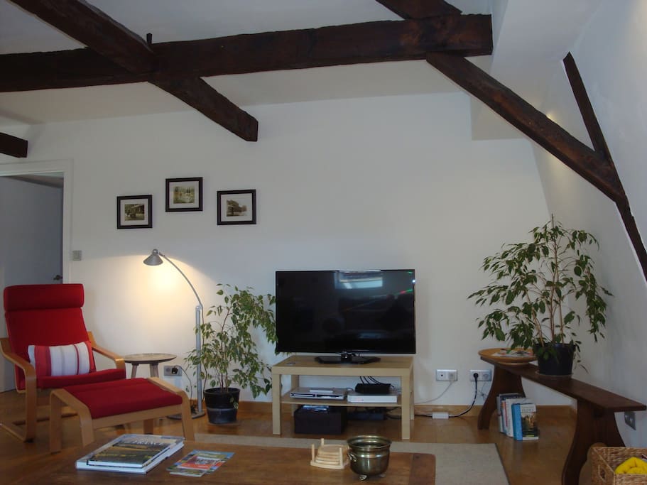 arm chair and flat screen tv, dvd player