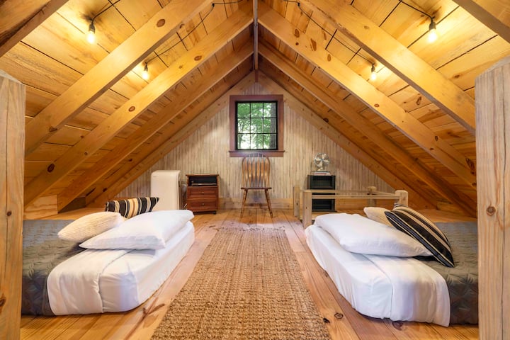 A great place to enjoy a rain storm, right underneath Trinity Treehouse's tin roof!
Credit: Dickersonarts.com