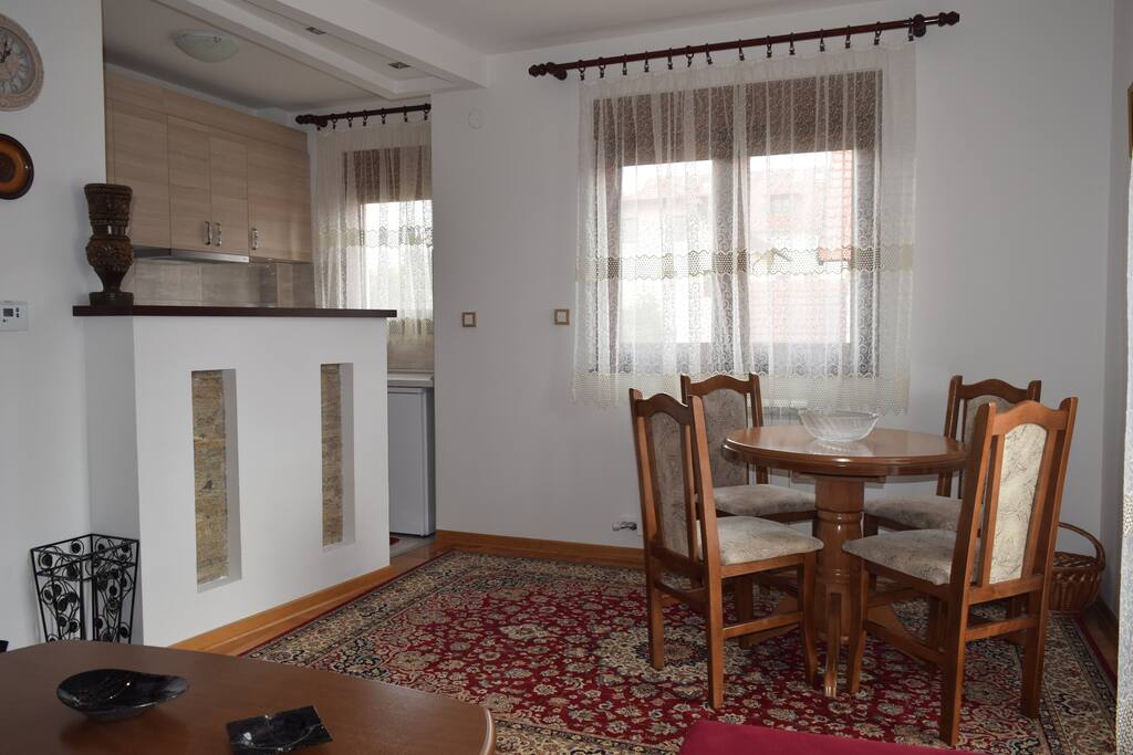 The dinning area with a cute kitchen.