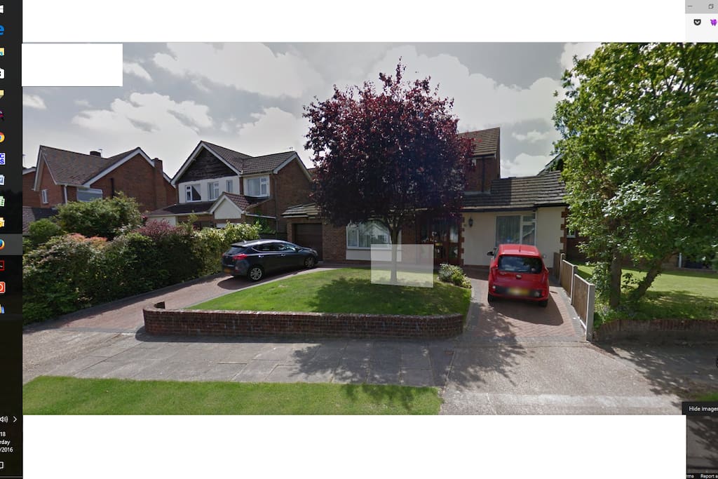 Street View - parking is provided where the red car is in the photo.