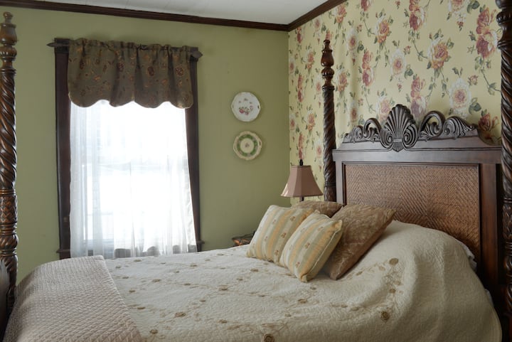 Monongahela River Bedroom with queen and single beds.  AC window unit, ceiling fan, shared bath. 