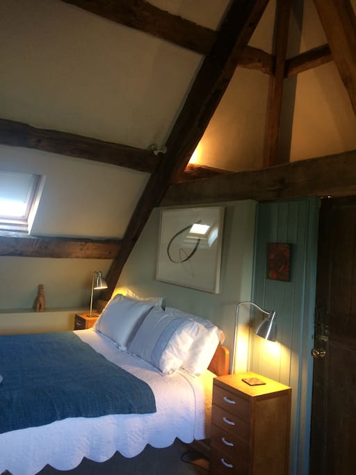 The bedroom with exposed oak frame