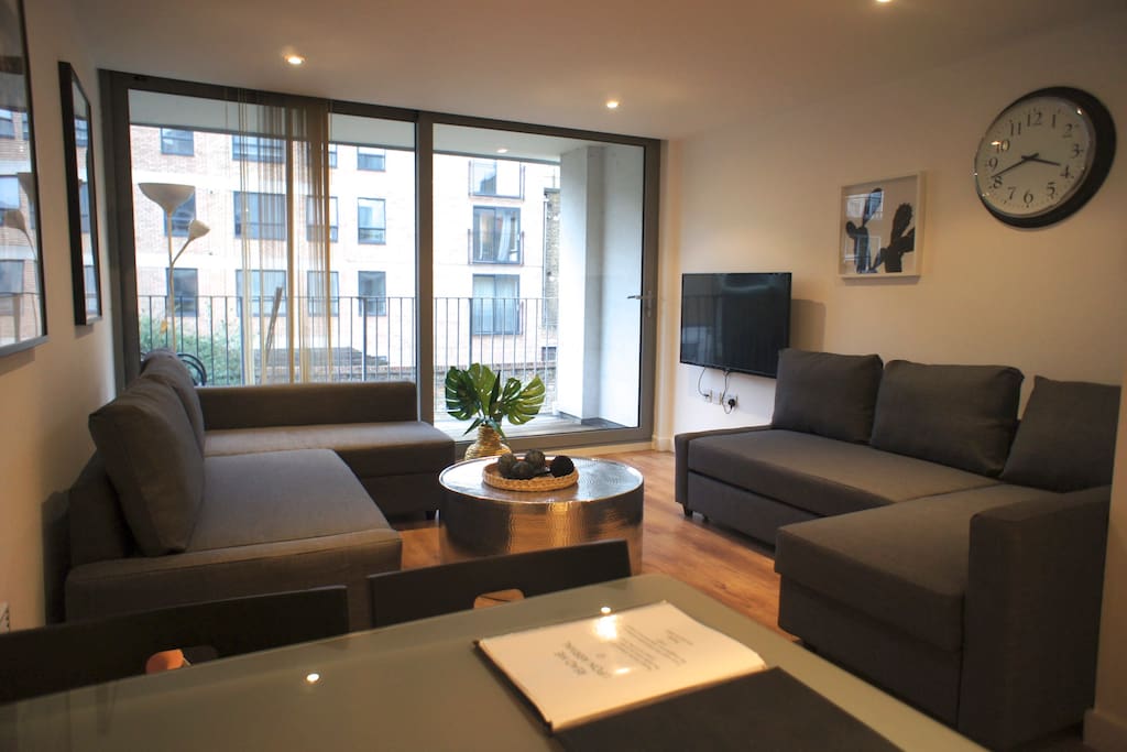 Here's your living room with private balcony and two double sofa-beds