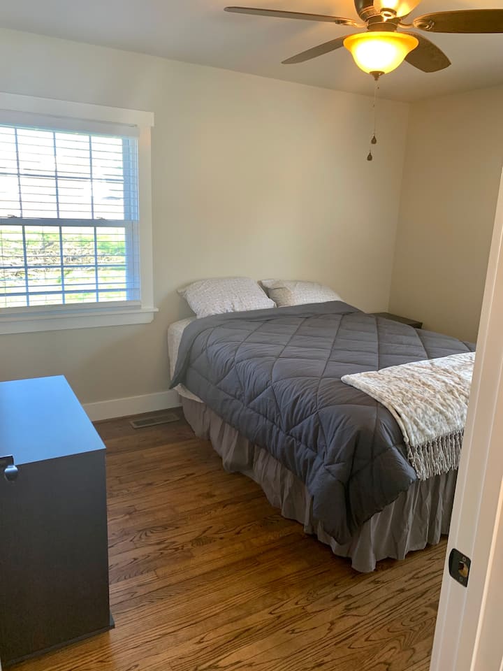 Queen bed (Master - room 1) and 1/2 bath