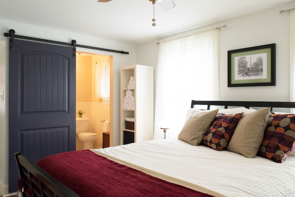 This private bedroom with lots of natural light has a full bathroom attached