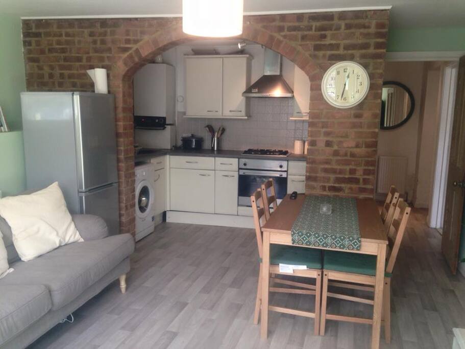 Lounge area with fridge freezer and dining table